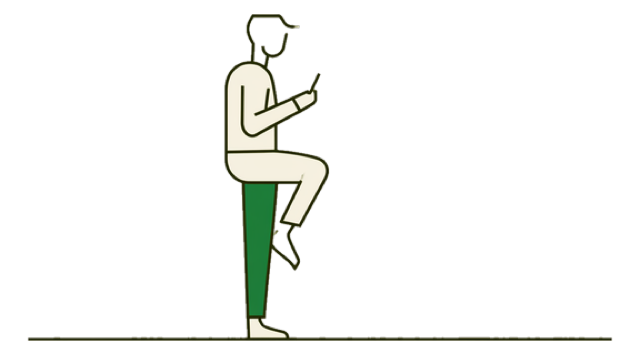 a person standing on one leg, phone held against their chest
